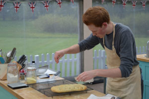 WARNING: Embargoed for publication until 21:00:01 on 28/09/2016 - Programme Name: The Great British Bake Off 2016 - TX: n/a - Episode: The Great British Bake Off 2016 - episode 6 (No. 6) - Picture Shows: Technical. Tom finishing his bread with salt. **NOT FOR PUBLICATION BEFORE 2100 HOURS WEDNESDAY 28th SEPT 2016** - (C) Love Productions - Photographer: Tom Graham